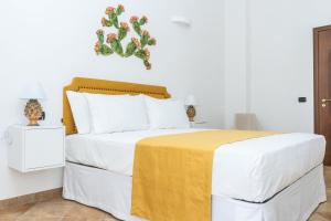 Postel nebo postele na pokoji v ubytování Relais Ruggiero