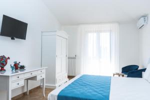 Postel nebo postele na pokoji v ubytování Relais Ruggiero