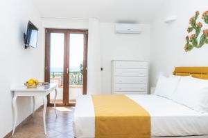 Postel nebo postele na pokoji v ubytování Relais Ruggiero