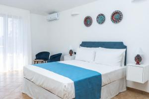 Postel nebo postele na pokoji v ubytování Relais Ruggiero + 37 fotografií