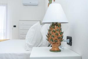 Postel nebo postele na pokoji v ubytování Relais Ruggiero