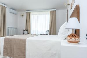 Postel nebo postele na pokoji v ubytování Relais Ruggiero