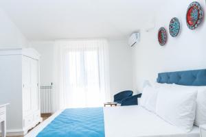 Postel nebo postele na pokoji v ubytování Relais Ruggiero