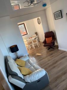 a living room with a couch and a table at Moray View, Macduff, Aberdeenshire. in Macduff