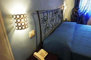 سرير أو أسرّة في غرفة في Bed & Breakfast Viziottavo