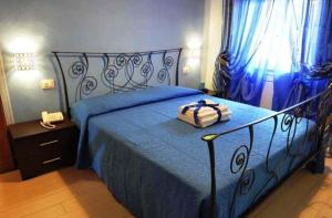 سرير أو أسرّة في غرفة في Bed & Breakfast Viziottavo