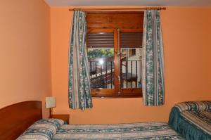 Ένα ή περισσότερα κρεβάτια σε δωμάτιο στο Hostal l'Escon
