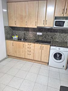 Kuchyň nebo kuchyňský kout v ubytování Apartamentos Simo B/P