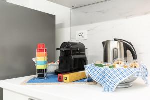 a kitchen counter top with a sink and a sink at Sea Loft Quinto - A due passi dal mare in Genoa