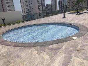 a swimming pool in the middle of a city at luxuriuso apartament in Cartagena de Indias