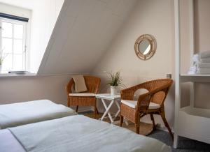 Postel nebo postele na pokoji v ubytování Hotel Ærøhus