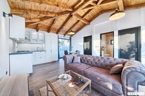 a living room with a couch and a table at Lux Ii in Murter