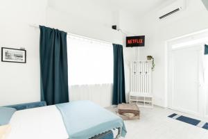 a bedroom with a bed and a sign that reads autism at Sea Loft Quinto - A due passi dal mare in Genoa