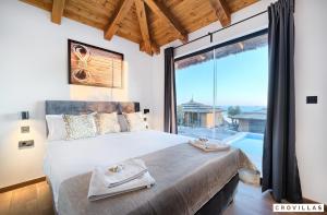 a bedroom with a large bed and a large window at Lux I in Murter +11 photos