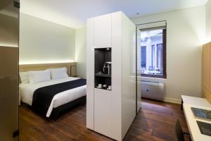 Postel nebo postele na pokoji v ubytování Hotel Altiplanico Bellas Artes