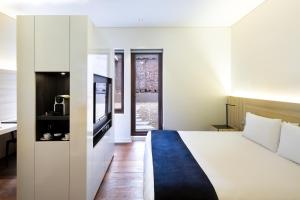 Postel nebo postele na pokoji v ubytování Hotel Altiplanico Bellas Artes