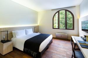 Postel nebo postele na pokoji v ubytování Hotel Altiplanico Bellas Artes