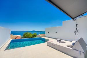 a view of a swimming pool from a villa at Akrogiali Apartments in Barbati