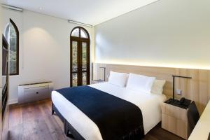 Postel nebo postele na pokoji v ubytování Hotel Altiplanico Bellas Artes