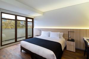 Postel nebo postele na pokoji v ubytování Hotel Altiplanico Bellas Artes
