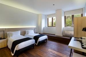 Postel nebo postele na pokoji v ubytování Hotel Altiplanico Bellas Artes