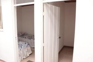 Cama o camas de una habitación en Casa Hotel Alaska