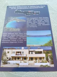 een brochure van een huis op het strand bij Eleni's Apartments in Agios Nikolaos