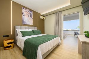 Ένα ή περισσότερα κρεβάτια σε δωμάτιο στο Nicolas Grand Suites, Adults Only