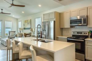 a kitchen with a large island in a room at Aquarius in St. George Island