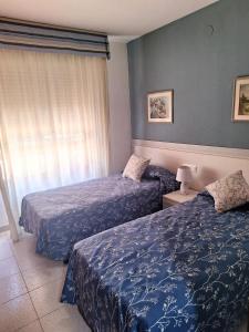 Postel nebo postele na pokoji v ubytování APARTAMENTO CENTRICO