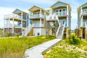 a row of houses with stairs in front of them at Aquarius in St. George Island