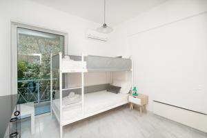 Ένα ή περισσότερα κρεβάτια σε δωμάτιο στο Phos Apartment by A&D Properties