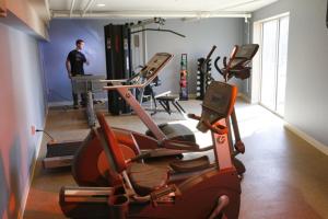 a man in a gym with several exercise bikes at Lancaster Arts Hotel in Lancaster