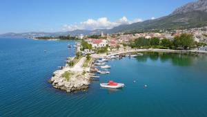 a group of boats in a large body of water at Apartman Ivan in Kaštela