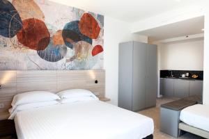 Postel nebo postele na pokoji v ubytování Hotel Cristallo