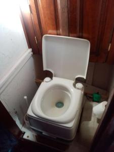 a small bathroom with a toilet with the lid up at Superbe vieux greement a La Rochelle in La Rochelle