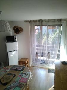 Kuchyň nebo kuchyňský kout v ubytování Appartement en residence