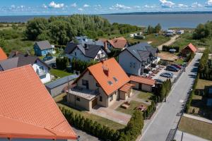 an aerial view of a residential neighbourhood with orange roofs at Pokoje gościnne Beata (Niska1) in Krynica Morska