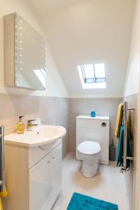 a bathroom with a sink and a toilet at The Old Threshing Barn in Newark-on-Trent