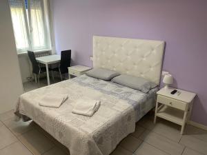 Posteľ alebo postele v izbe v ubytovaní Stadio 1 - Appartamenti monolocali con bagno privato Verona
