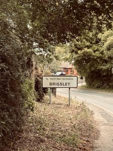 a street sign on the side of a road at Prelude Guesthouse, Brigsley Grimsby in Grimsby