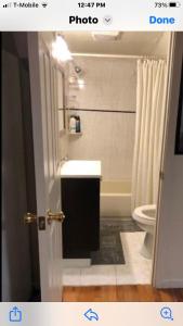 a bathroom with a sink and a toilet at Highland Park Pittsburgh in Pittsburgh +48 photos