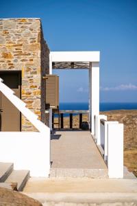a building with a view of the ocean at Saint Nicholas Resort - Villas in Kithnos