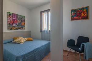 A bed or beds in a room at Villa Candelara
