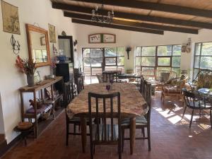 a dining room with a large table and chairs at Cabaña La Rinconada Cayara in Potosí