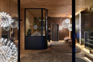 a lobby with christmas lights and a mirror at Grau Roig Andorra Boutique Hotel & Spa in Grau Roig