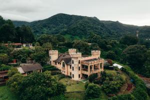 an aerial view of a mansion in the mountains at Bambuda Castle in Boquete