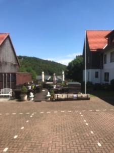 a brick parking lot in a town with buildings at fun4all-holidayhome in Medebach