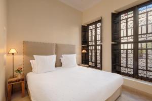 Llit o llits en una habitació de Riad Dar Karma