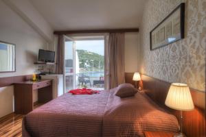 Postel nebo postele na pokoji v ubytování Gina Bed & Breakfast
